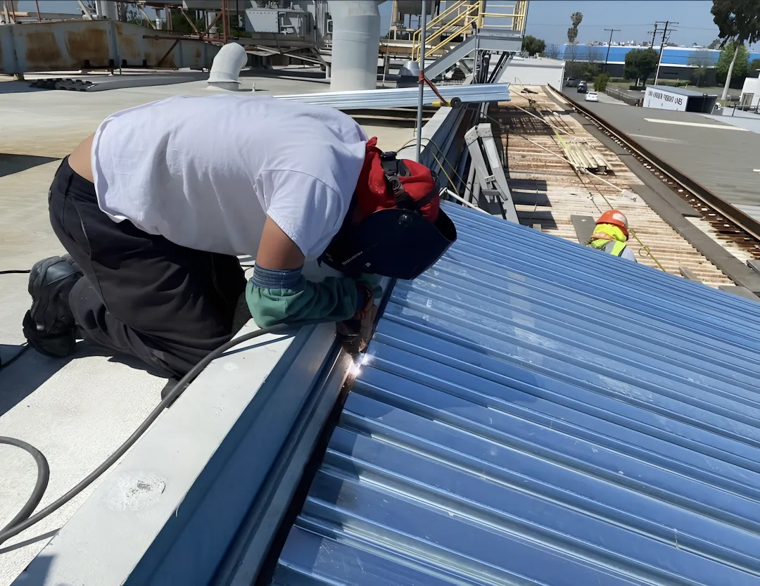 Skilled welder creating custom metal fabrication with precision equipment