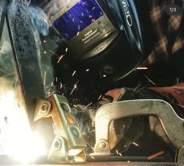 Professional technician repairing automatic gate system