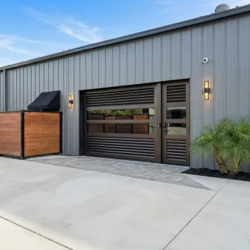 Commercial property with professionally installed custom metal fence and automated gate