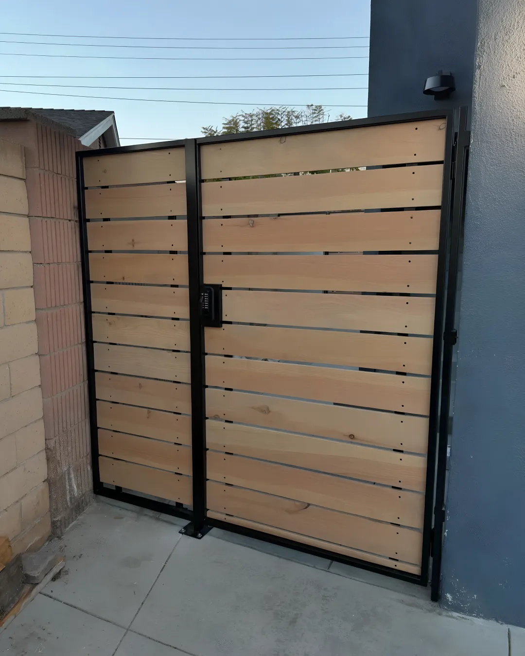 Beautiful custom aluminum driveway gate with decorative panels