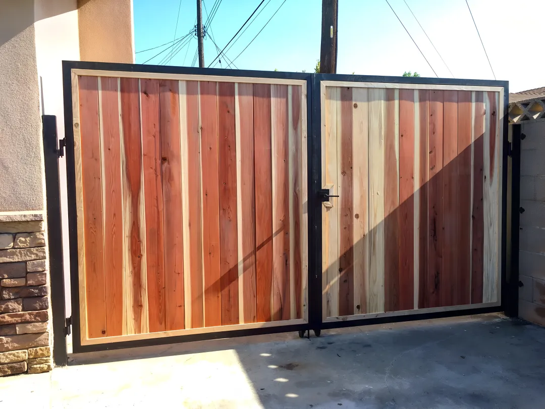 Professional fence installer comparing different materials with homeowner