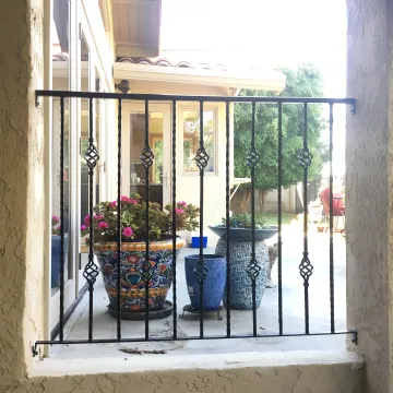 Modern commercial fence installation with steel and iron materials