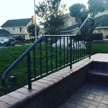 Professional fence installation team working on custom home fencing project