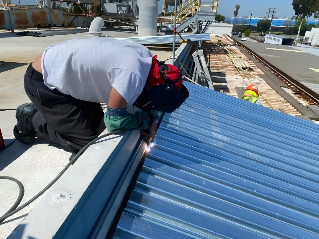 Metal building undergoing professional structural repair