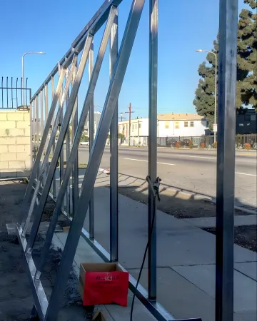 Professional pool fence installation around residential swimming pool