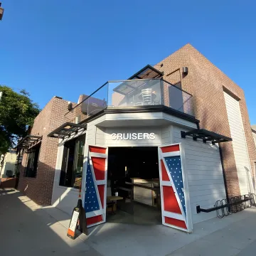 Modern glass railing system installed on outdoor deck with clear views