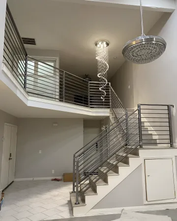 Custom iron staircase railing installation in a Holmesburg home