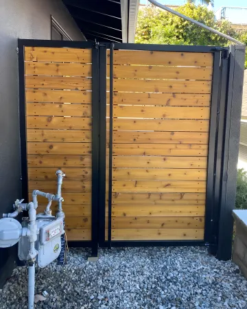 Vinyl fence and aluminum gate combination showing quality craftsmanship