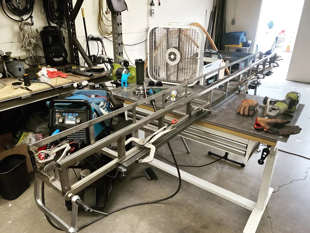 Industrial steel fabrication workshop with welding equipment