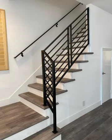 Beautiful custom staircase with integrated wood and iron design in Westminster home