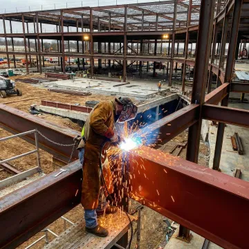 Professional welder performing on-site structural welding work in Fullerton, CA
