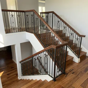 Custom wrought iron and wood staircase railing installation in modern Fullerton home