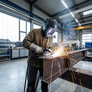 Professional welder working on metal fabrication project in Anaheim workshop
