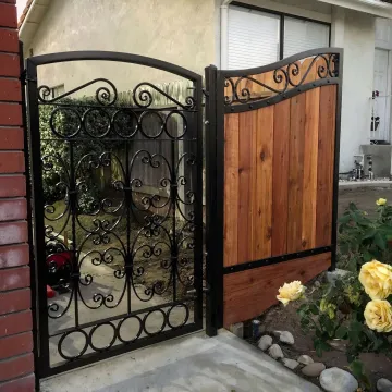 Custom wrought iron gate with wood accents showcasing luxury craftsmanship