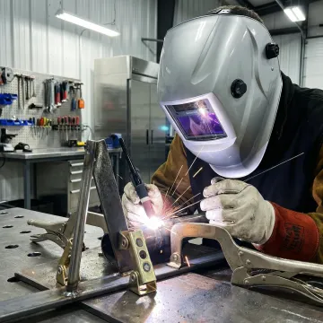Professional welder performing precision metal fabrication in Santa Ana workshop