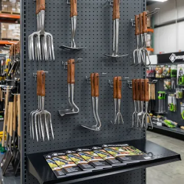 Wolverine Tools professional-grade landscape hand tools on display at a distributor location