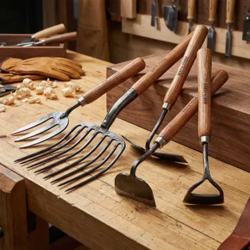 Close-up of professional-grade forged steel lawn and garden tools manufactured by Wolverine