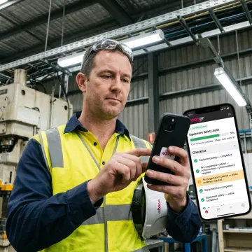 Safety manager conducting a digital audit on a tablet