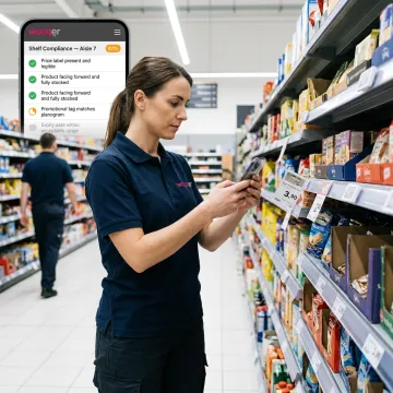 Retail associate completing product compliance audit