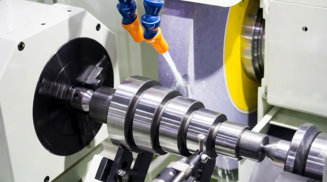 Precision cylindrical grinding machine producing ultra-fine surface finish on hardened shaft