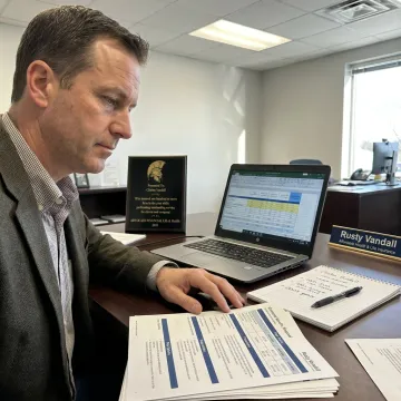 Insurance advisor comparing employee benefits plans