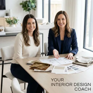 Professional interior designer consulting with homeowner reviewing floor plans and design materials