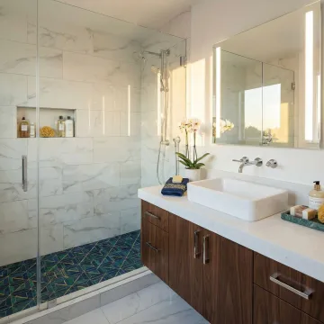 Modern bathroom renovation with professional interior design featuring elegant fixtures and tile work