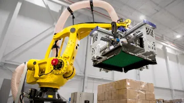 Industrial 4-axis palletizing robot arm stacking heavy cases on warehouse pallet