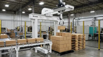 Yushin PA-40 compact palletizing robot handling boxes on manufacturing floor