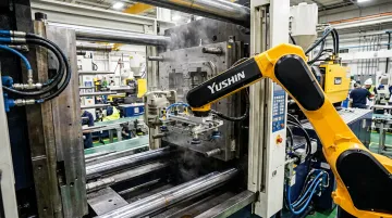 Yushin servo take-out robot extracting molded part from open injection press