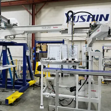 Injection molding robot automation in a manufacturing plant