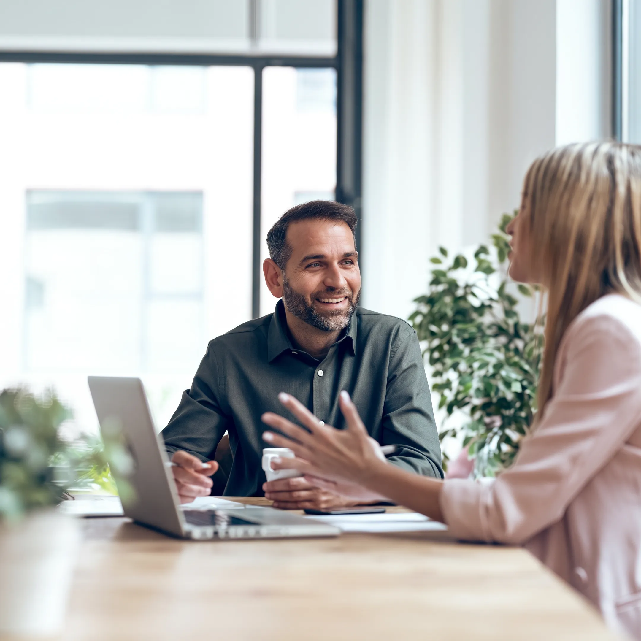 Financial advisor explaining business cash flow chart to owner