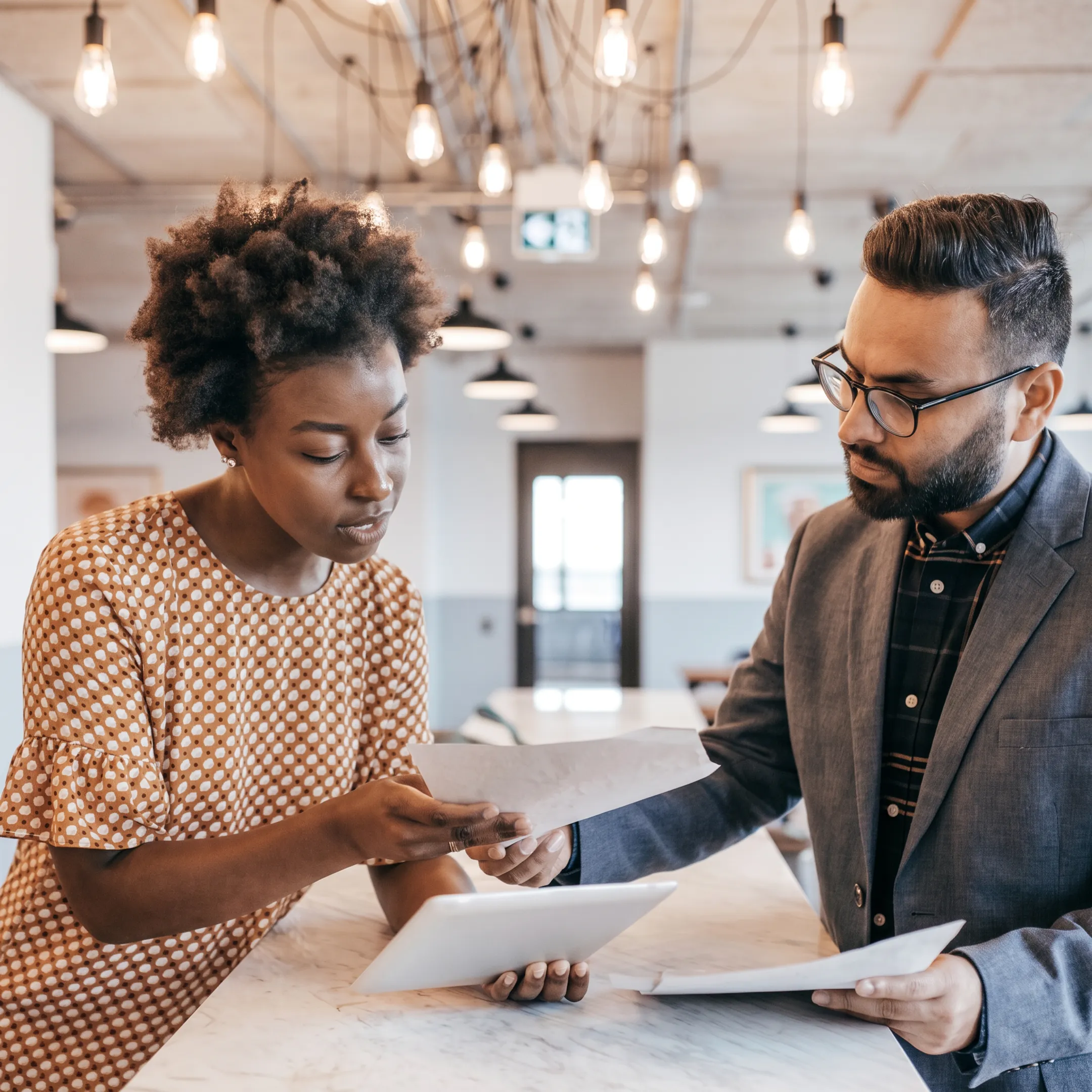 Advisor explaining financial performance analysis to a small business owner