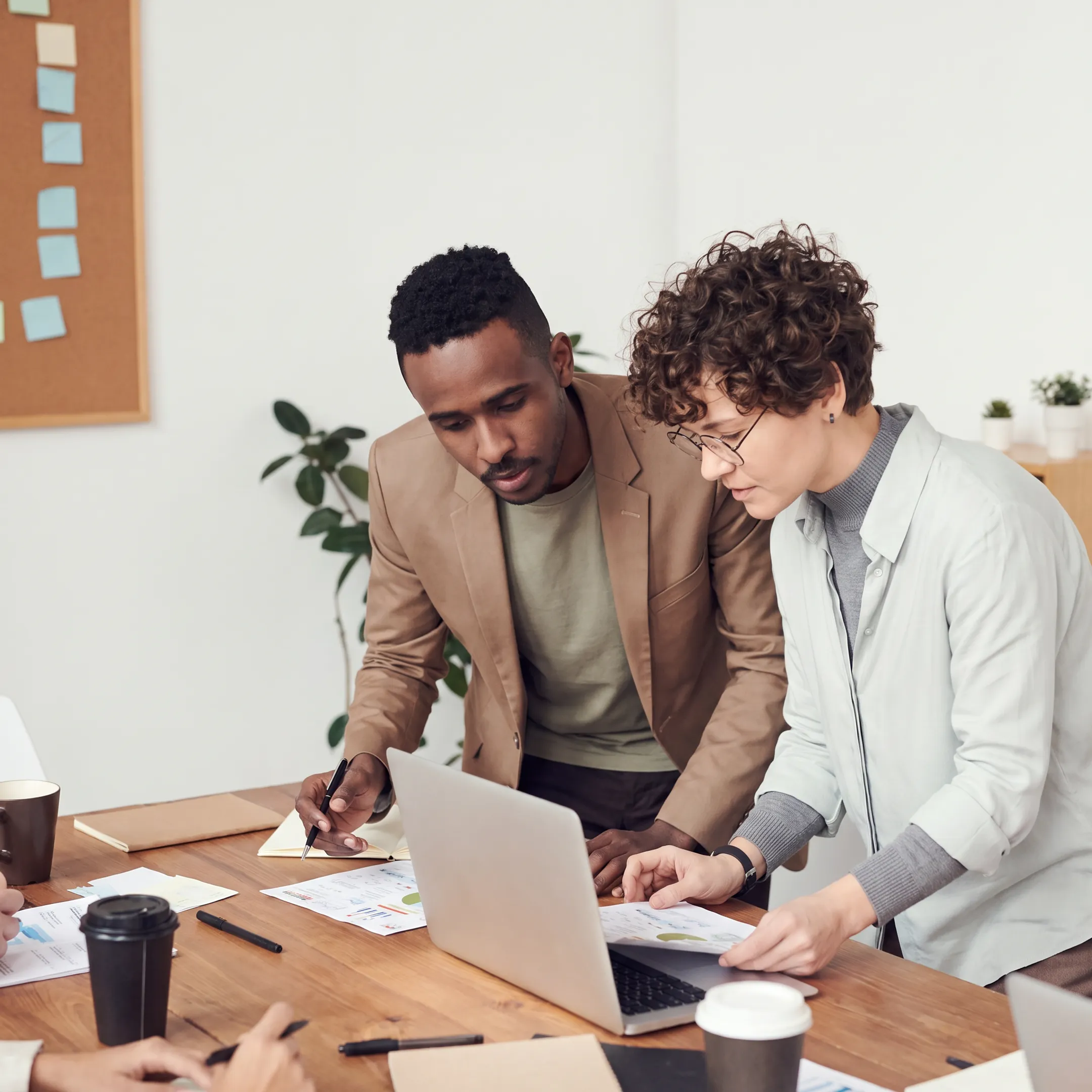 Accountant reviewing tax documents and financial reports with a business owner in an Ohio office
