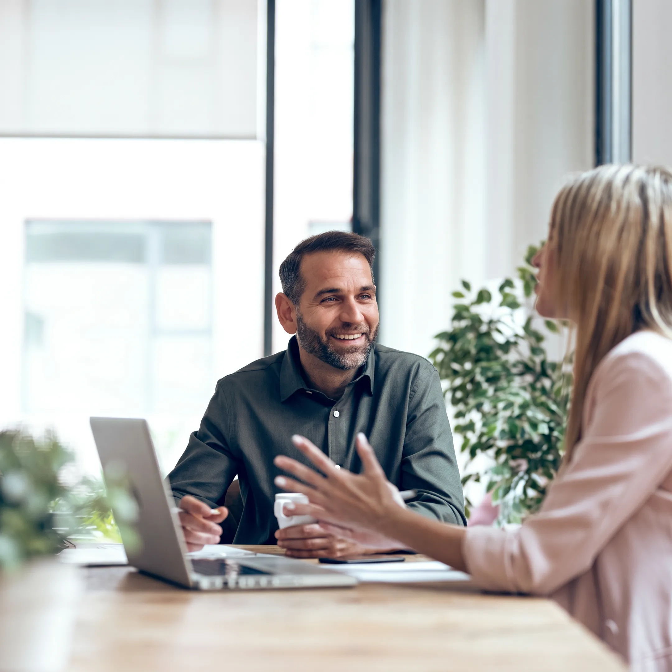 Advisor explaining financial performance charts to a business owner