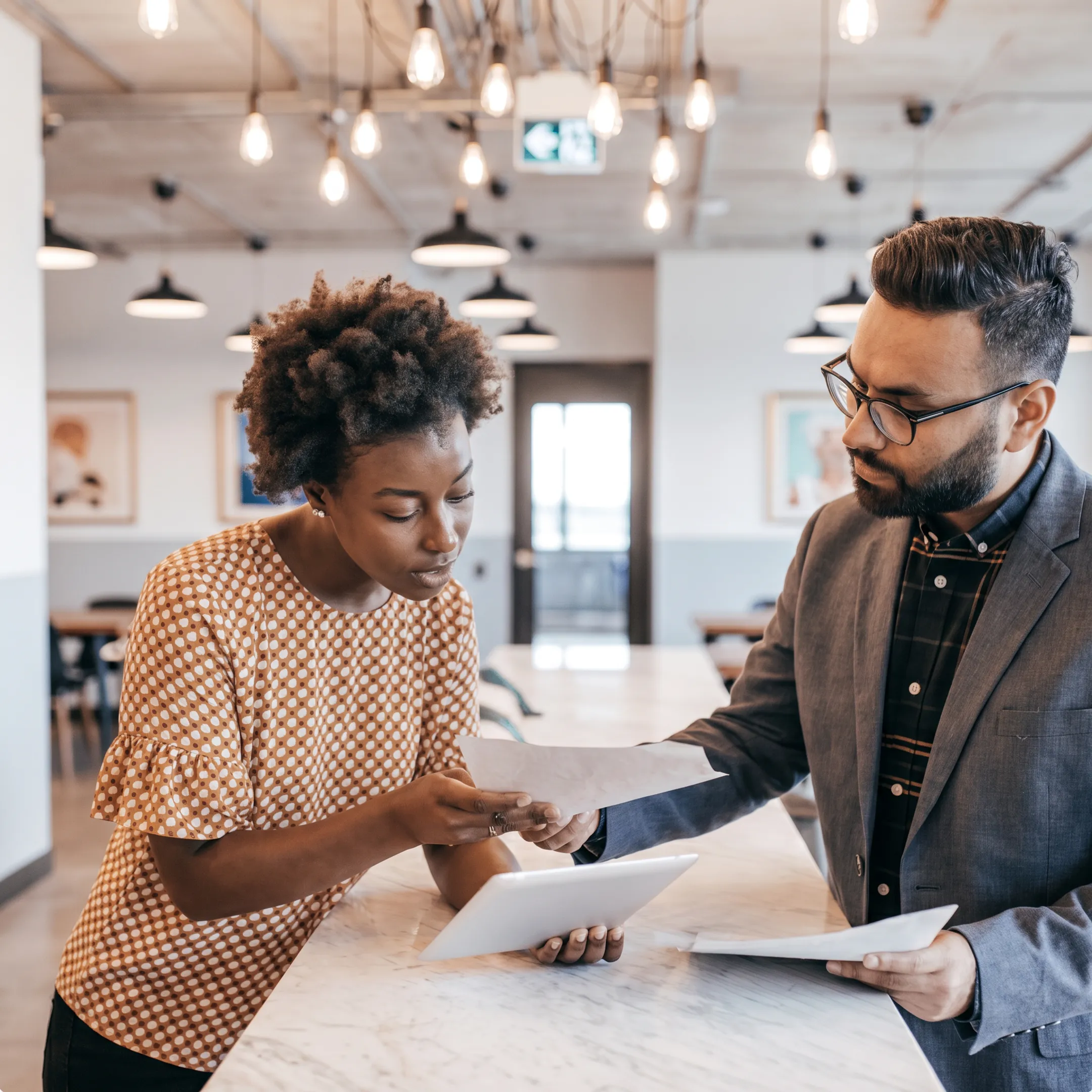 CPA reviewing small business financial reports with an owner