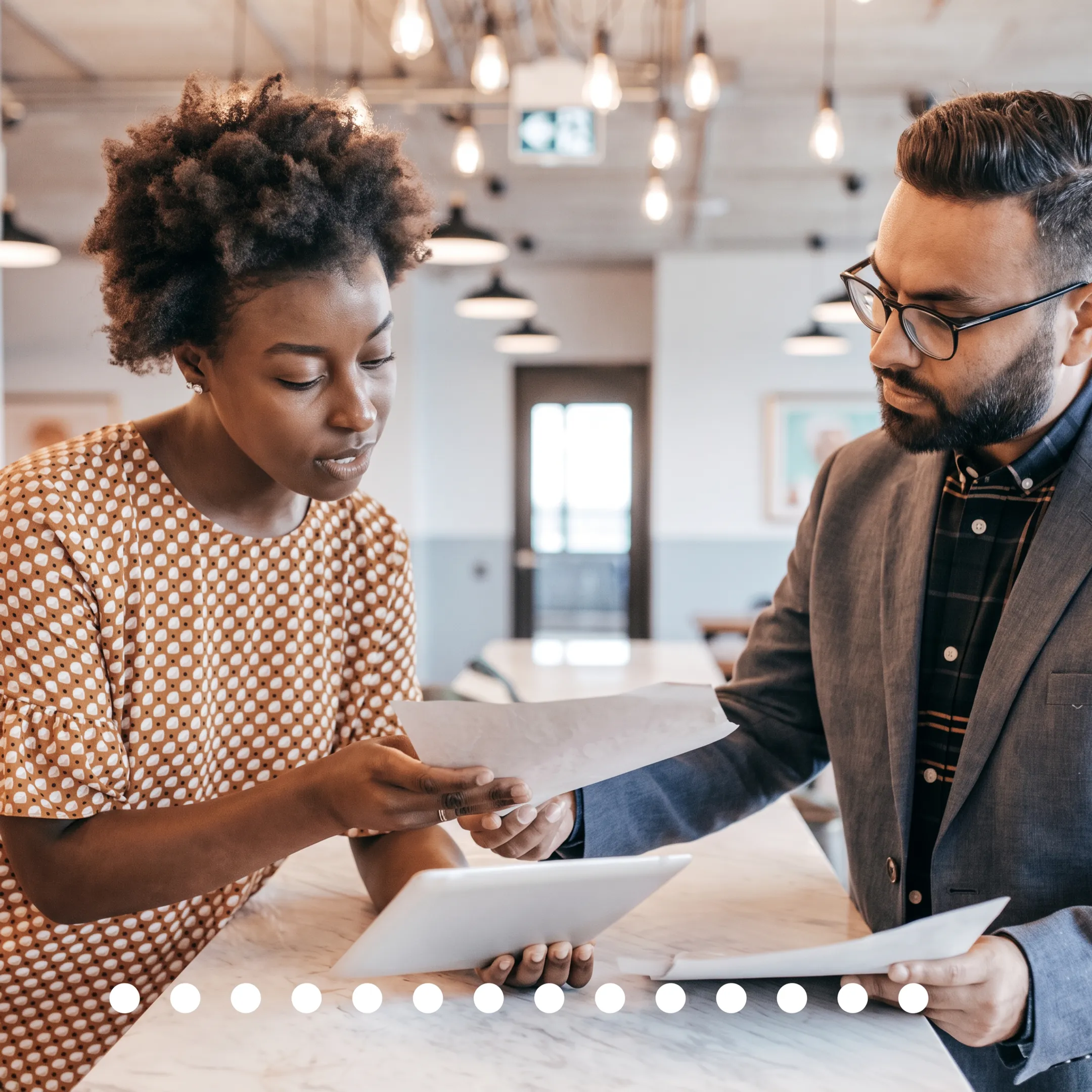 Accountant reviewing startup financial documents with a business owner