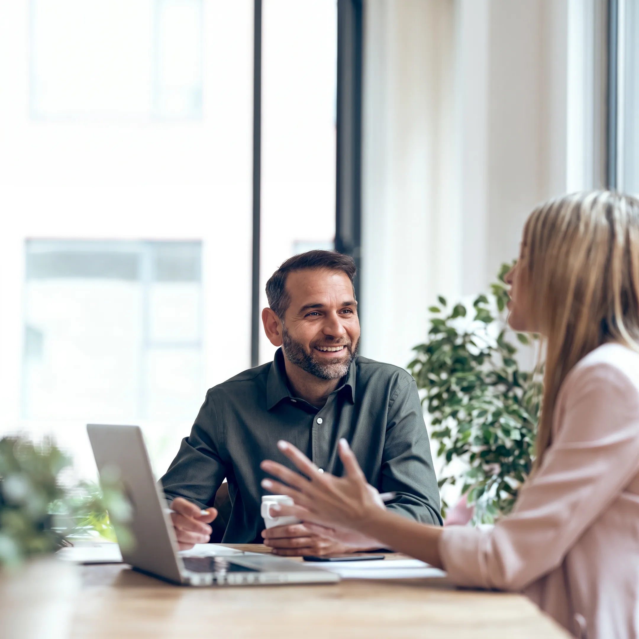 Advisor explaining startup financial reports to an entrepreneur