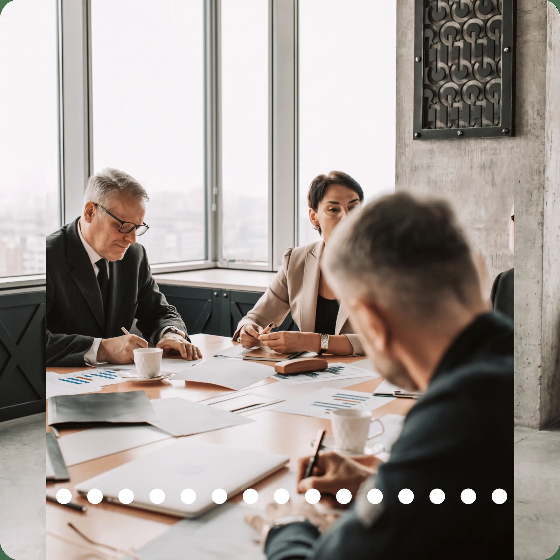 Business advisor reviewing financial forecasts and budget reports with an owner