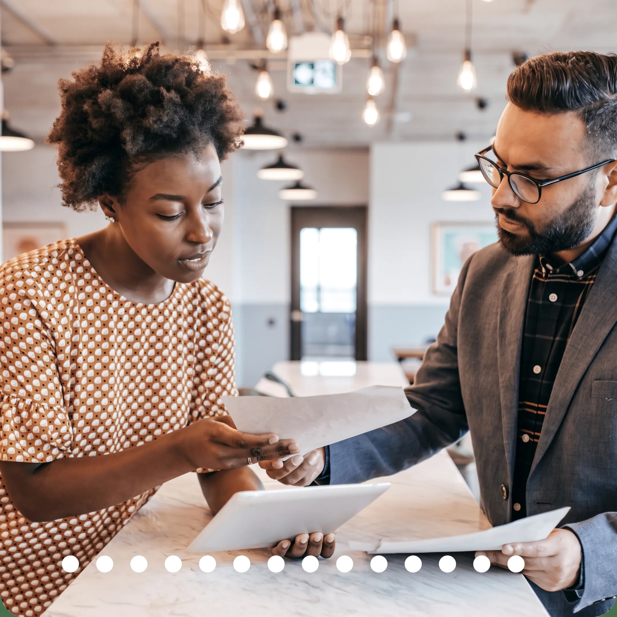 Advisor discussing tax planning documents with a business owner