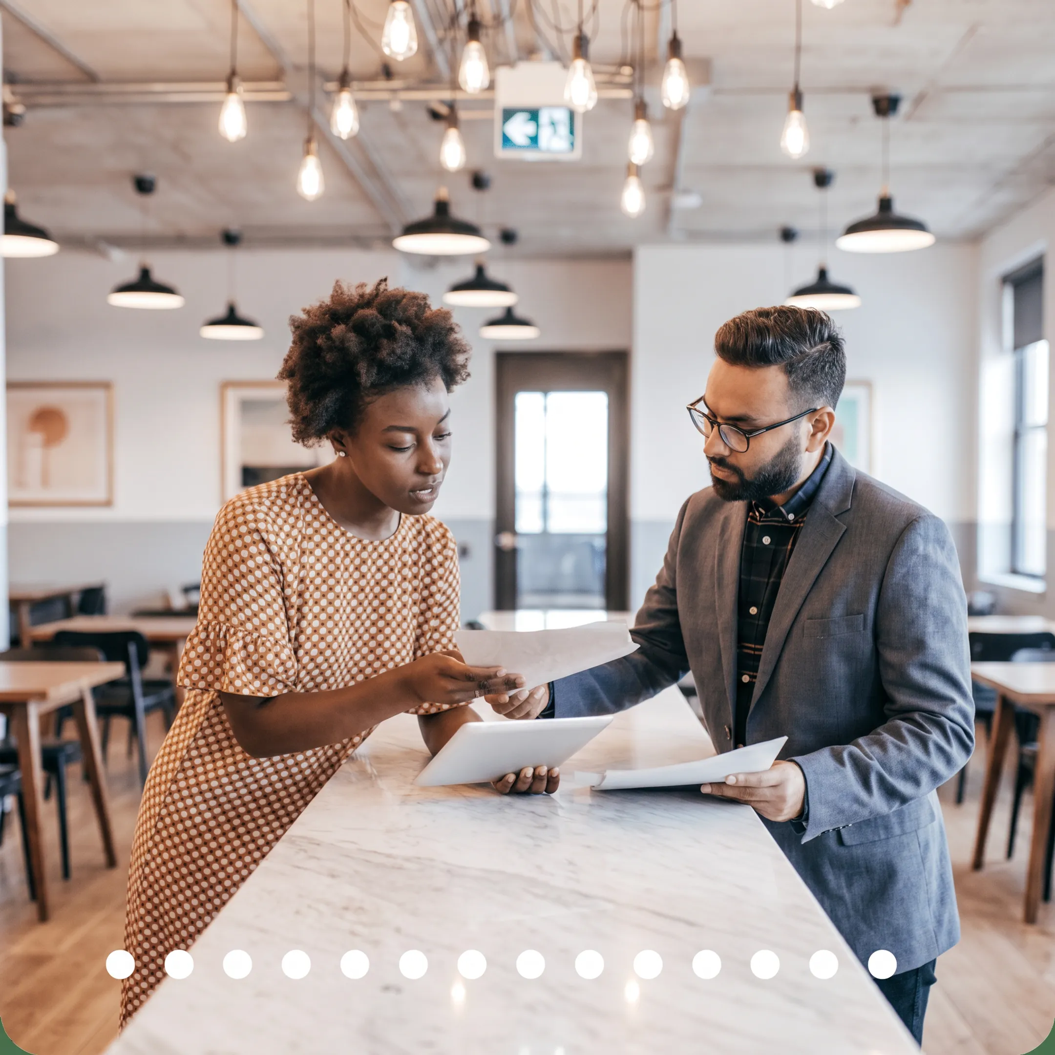 Tax professional discussing business planning documents with an owner
