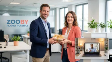 Manager presenting recognition gift to employee during one-on-one team meeting