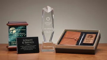 Custom engraved employee milestone award plaques trophies and branded gift sets