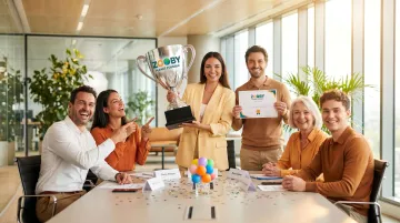 Office team laughing together during fun employee awards ceremony celebration