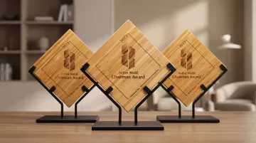 Engraved employee recognition award plaques displayed on modern office desk